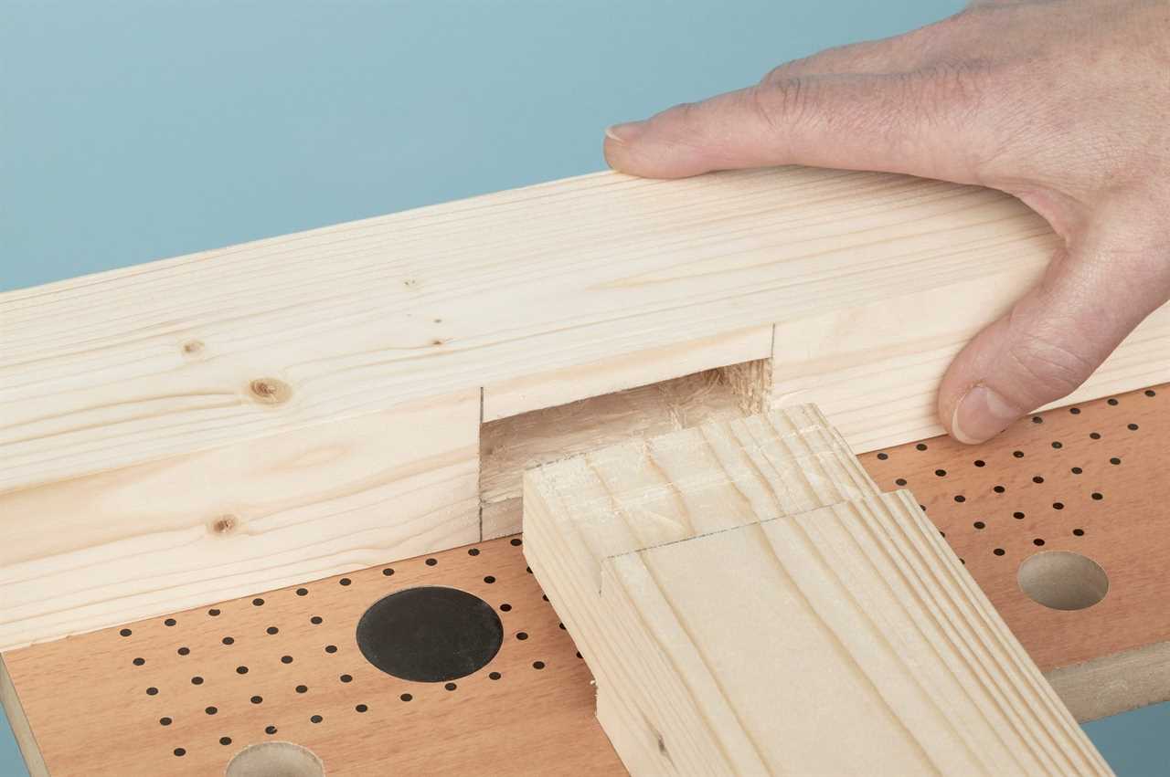 Person joining together a mortise and tenon joint