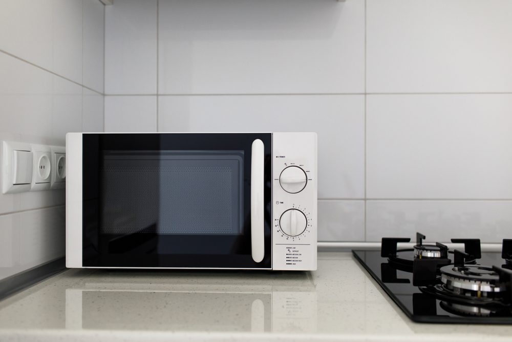 Modern kitchen interior with electric and microwave oven