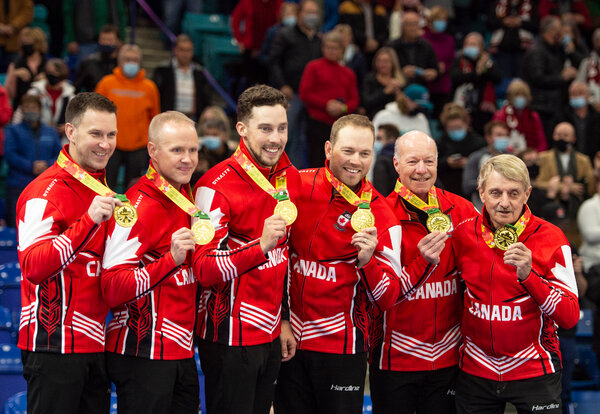 Canada’s men’s curling team at the 2021 Olympic trials, with two honorees on the right. Team members are isolating away from their families ahead of the Olympics.