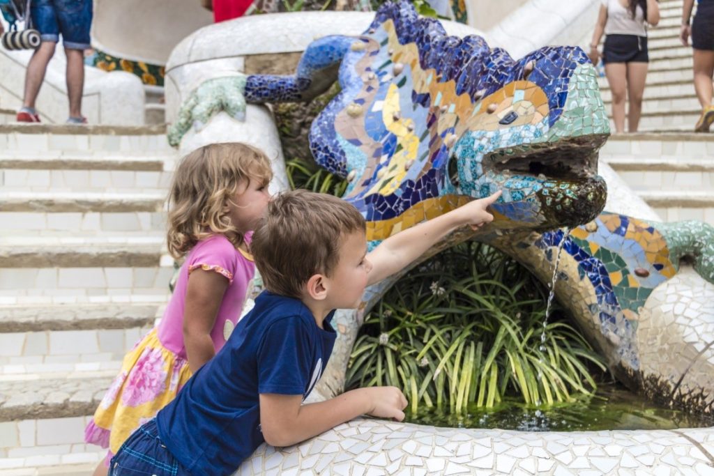 two kids having fun with fountain