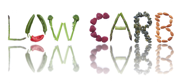 Fruits, vegetables and seeds spelling the word low carb