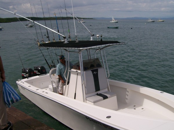 white boat on the water ready for deep sea fishing