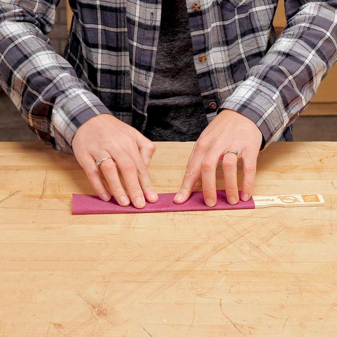 making a file with a paint stick and sand paper