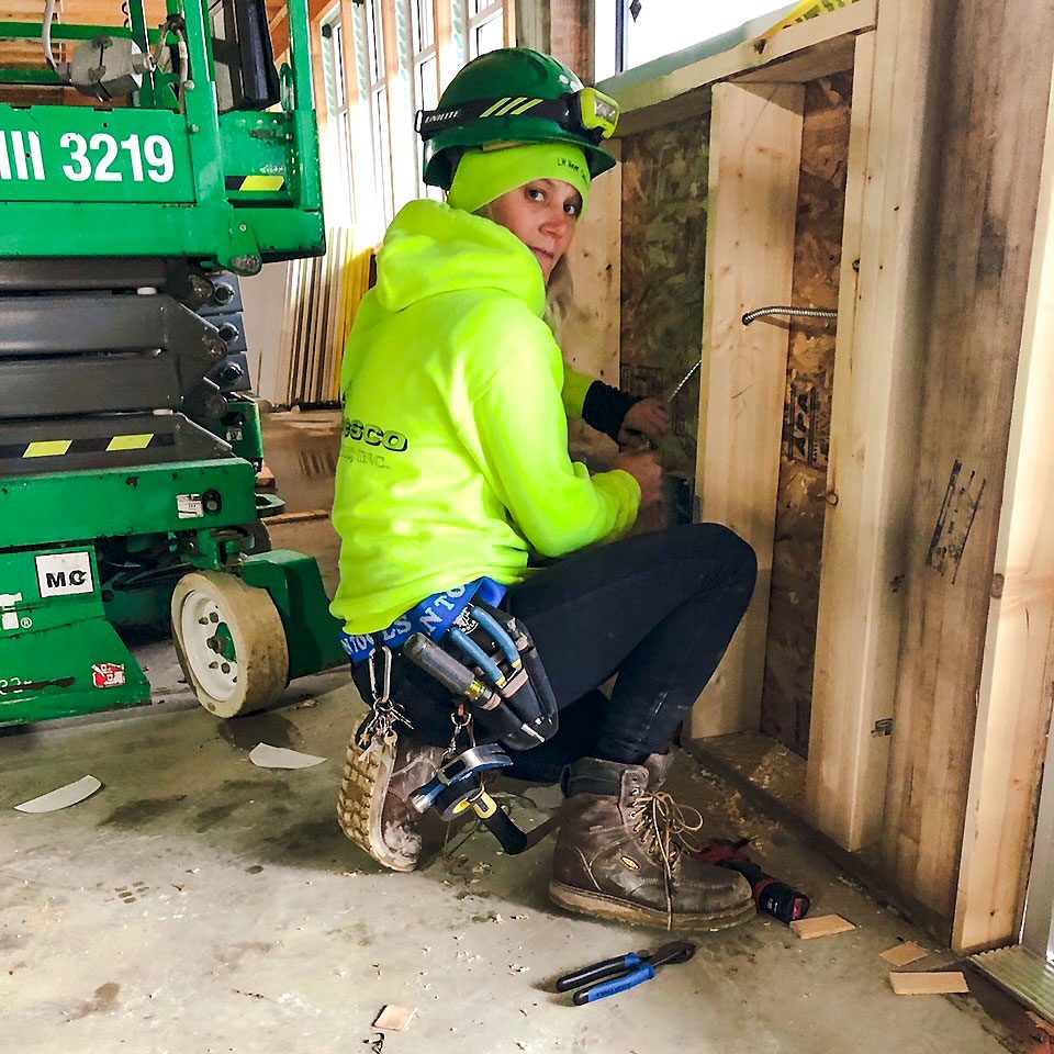 Maggie Rogosienski in a hardhat at work