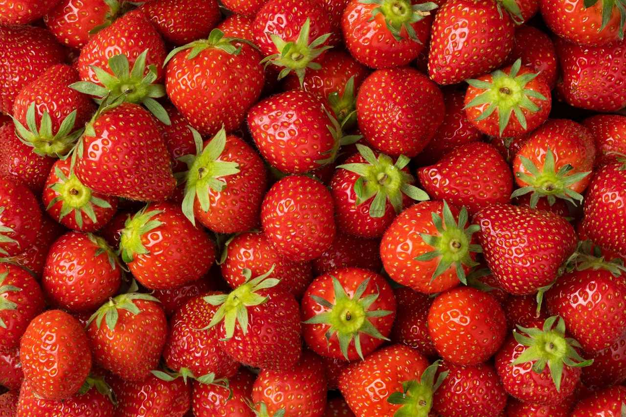 Whole fresh strawberries close up full frame