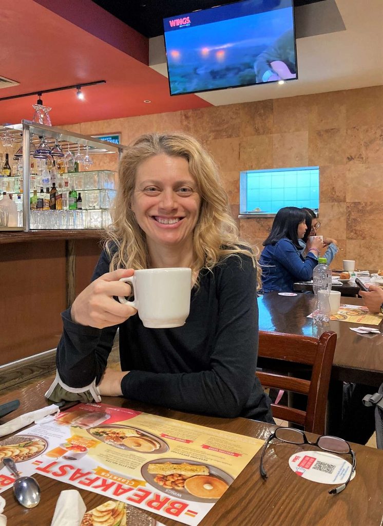 woman drinking coffee at the mexico city airport