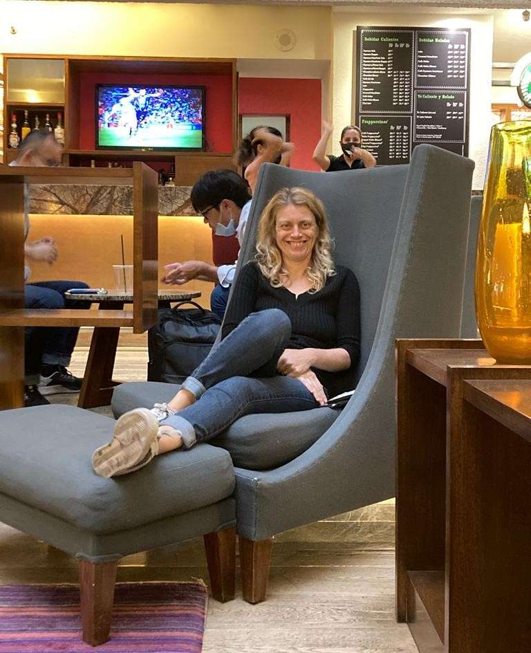 woman sitting on a couch at the mexico city airport