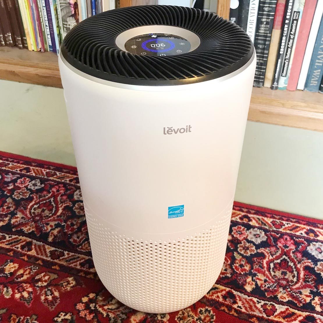 view of the screen on the Levoit 400s Air Purifier sitting on the floor of a home library