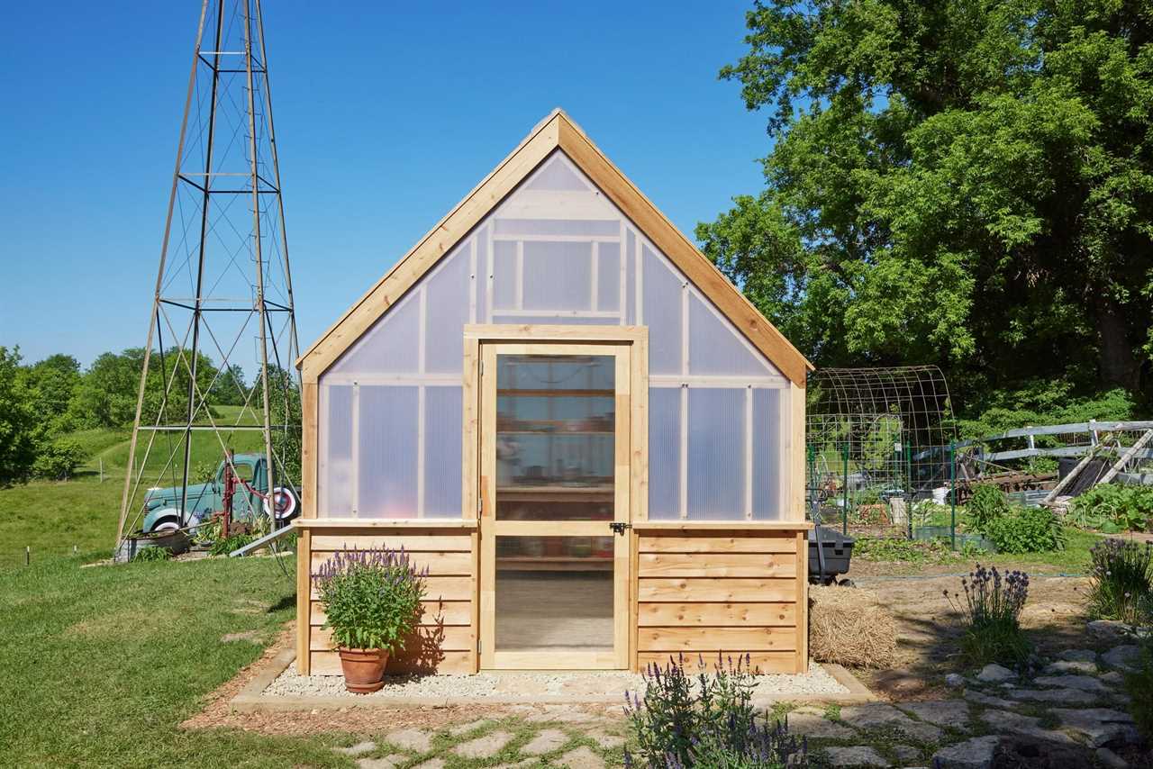 finished DIY greenhouse in a country setting