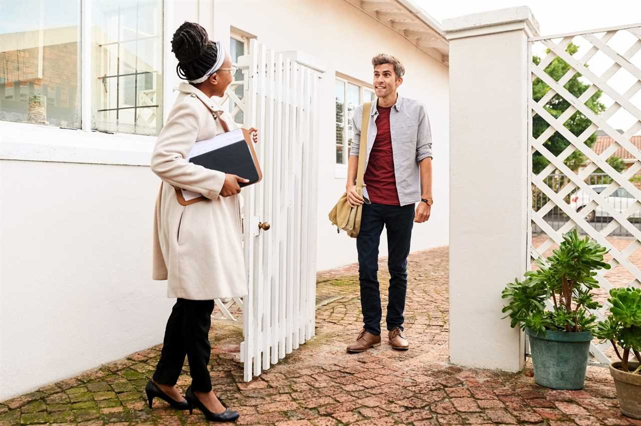 Real Estate Agent Receiving A Client For An Open House