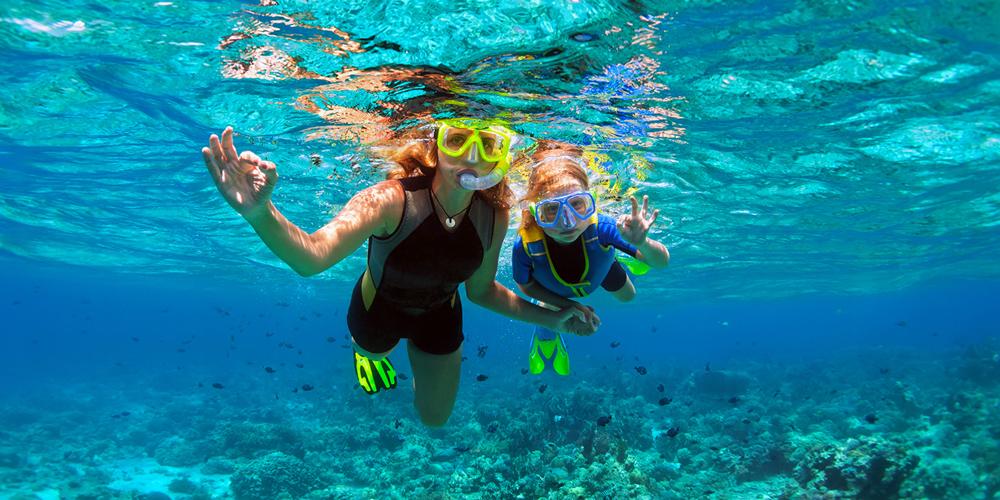 a woman a kid snorkeling in egypt