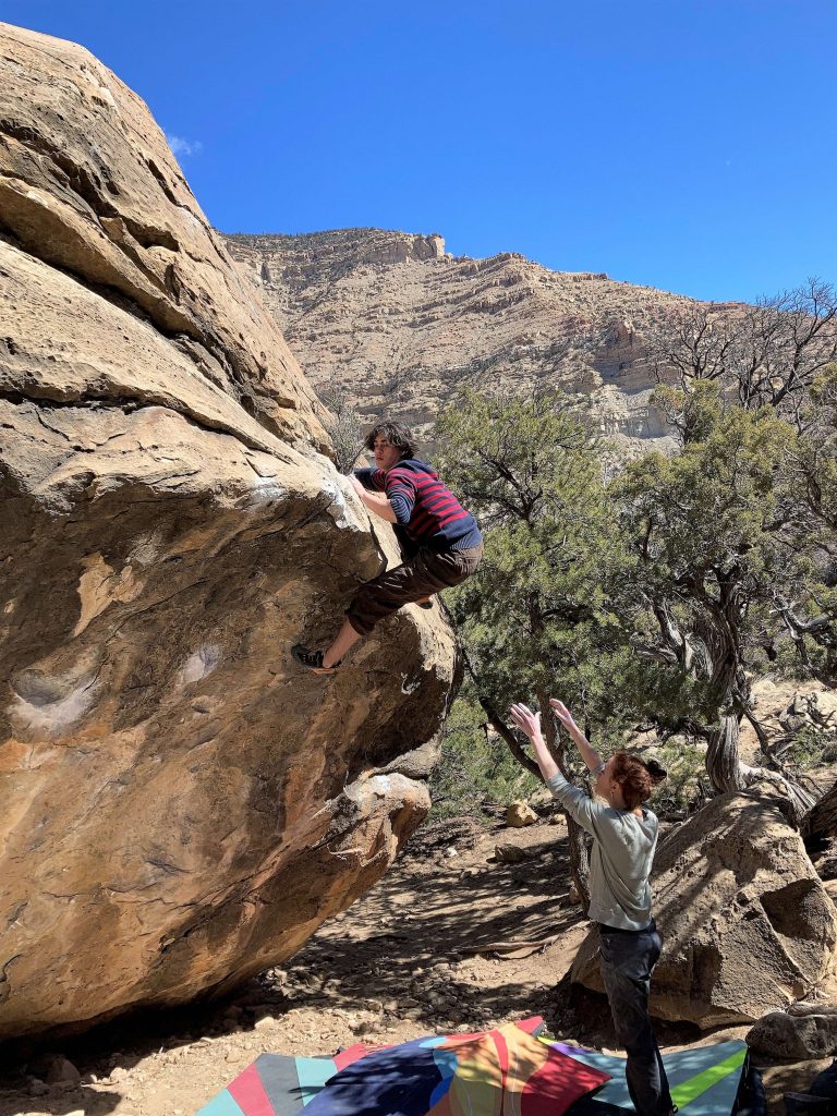 a guy climbing a rock in joe valley