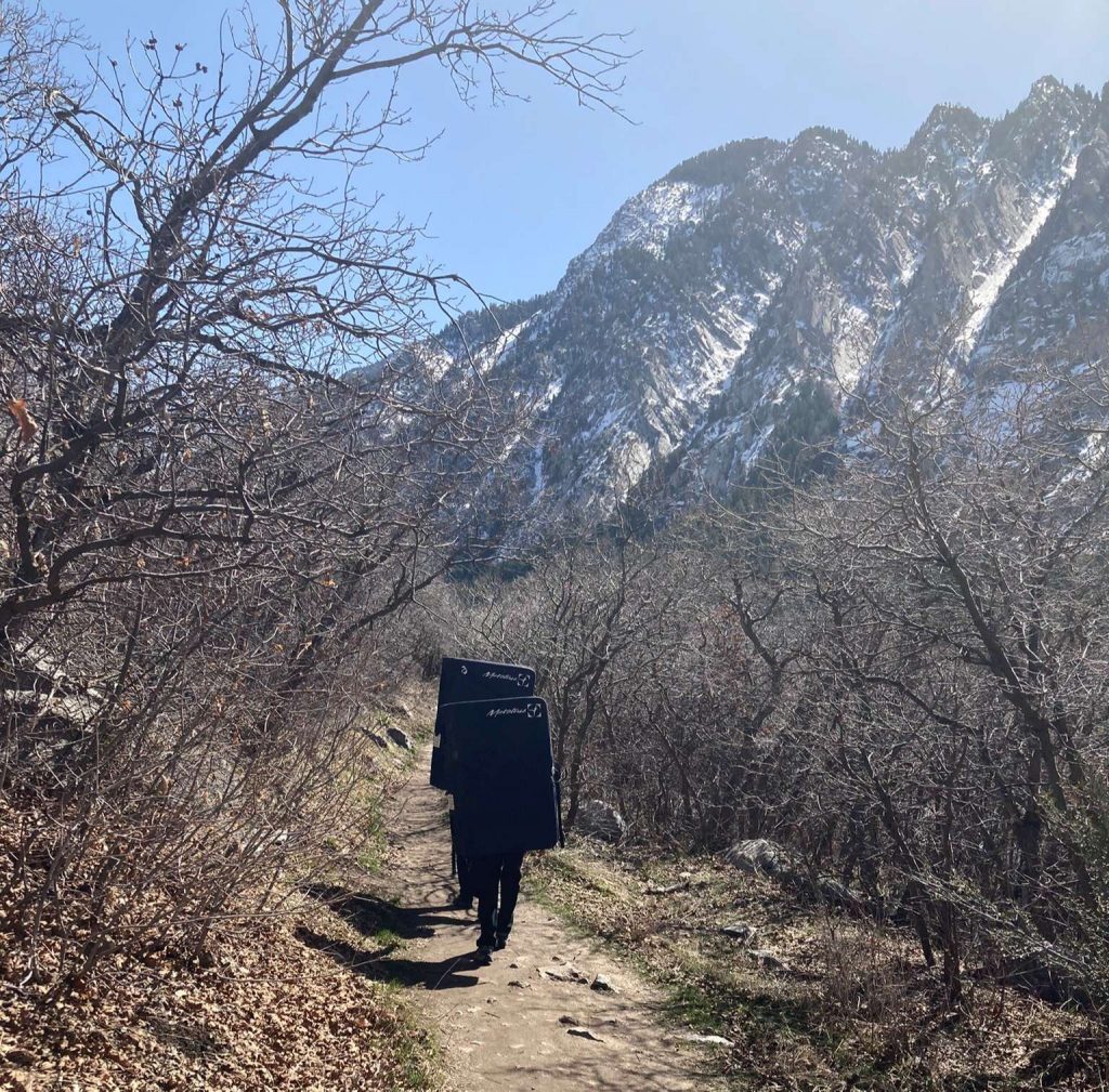 guys carrying crash pads for climbing in at little cottonwood canyon utah