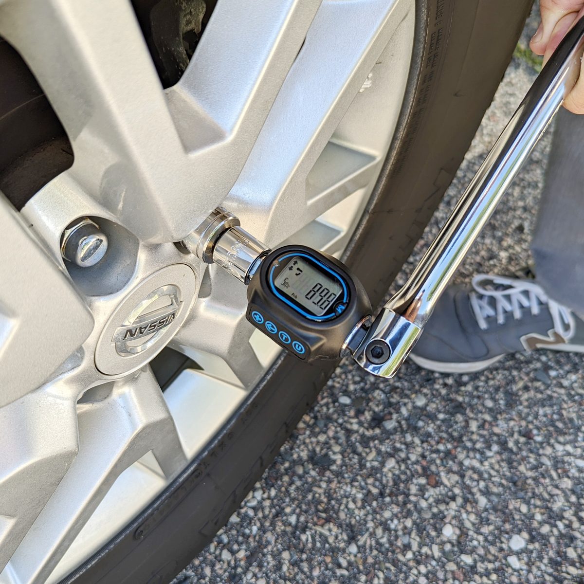 using a Performance Tool Digital Torque Adapter on a tire