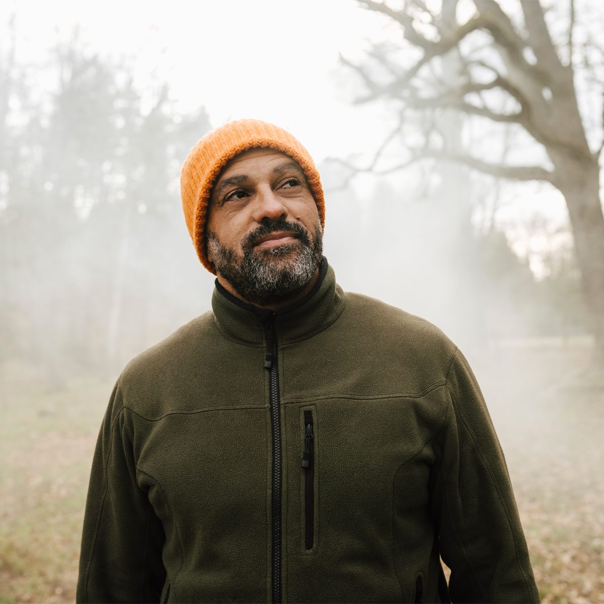 Gettyimages 1326609844 Smiling Male Explorer Looking Away While Standing In Forest By Maskot