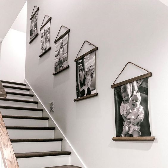 Rustic wire photos hanging on the staircase wall