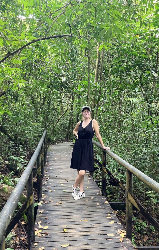 woman on a wooden bridge in manuel antonio national park