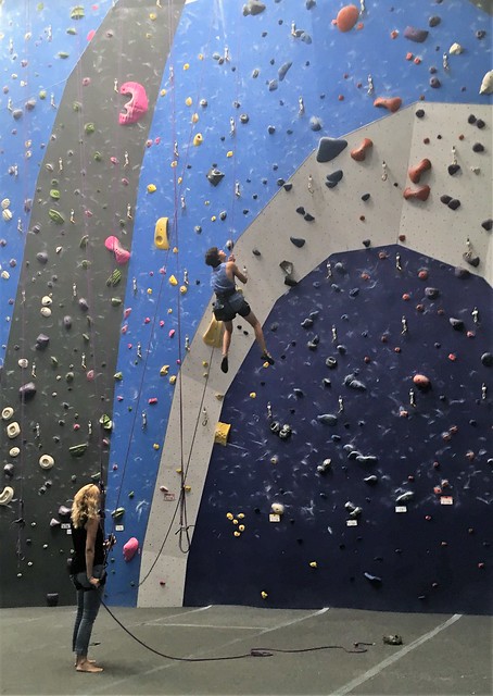 mom and son at a indoor climbing gym