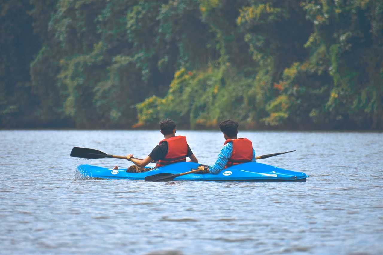 guys on a lake doing kayaking