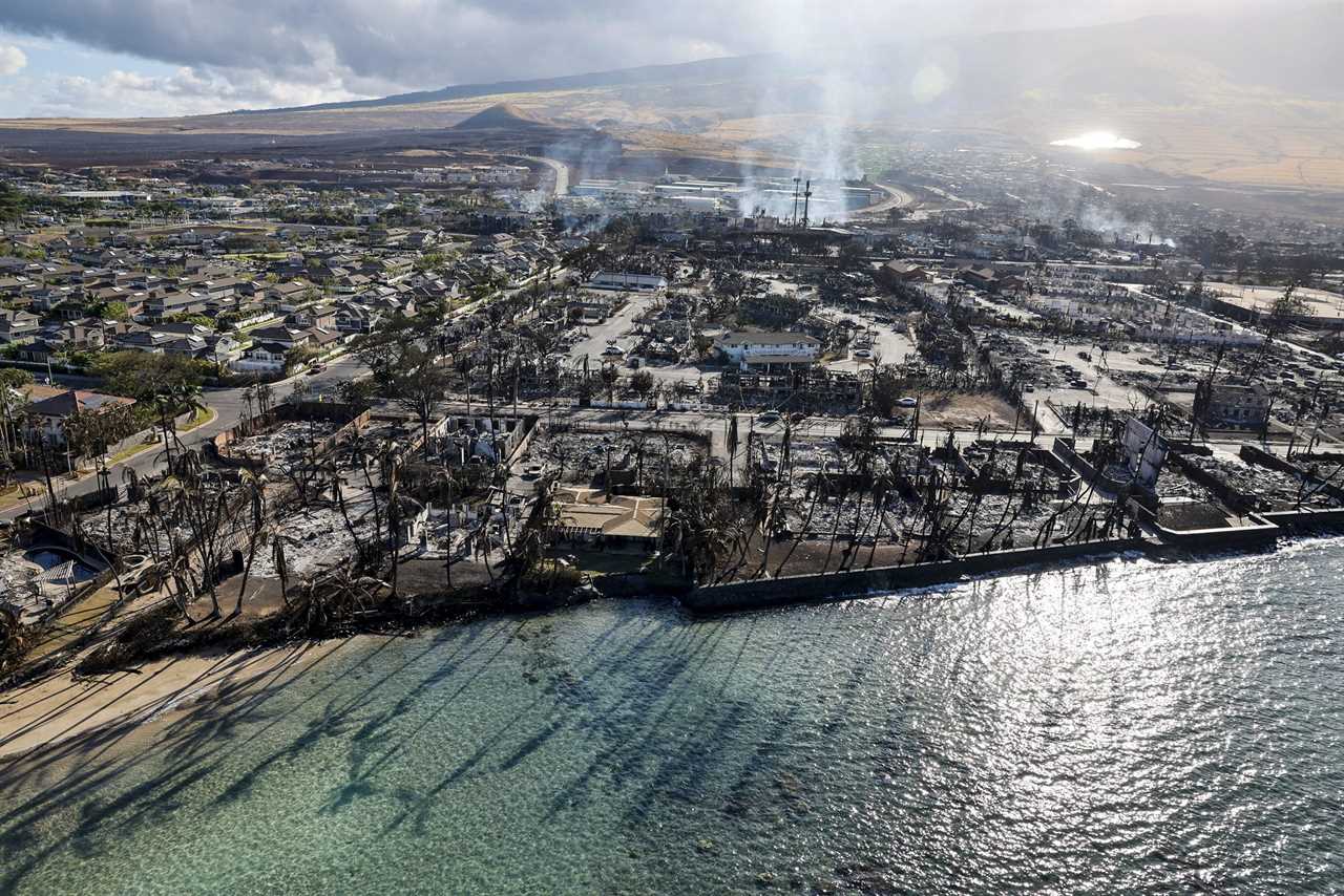 Buildings still smolder days after a wildfire gutted downtown Lahaina.