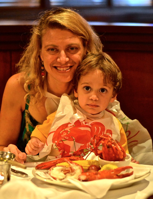 mom and son eating lobster at atlantic fish company in boston