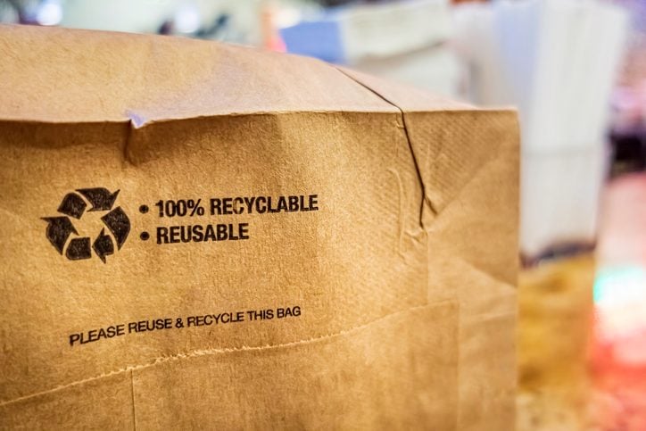 Brown paper bag that is 100% recyclable and reusable on a counter