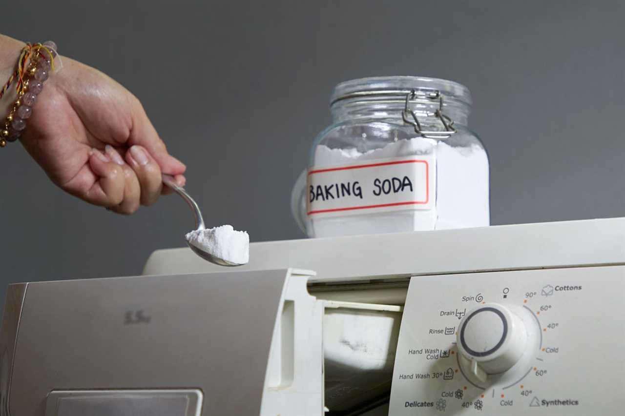 Woman Adding Baking Soda into Washing machine to wash clothes for a brighter finish